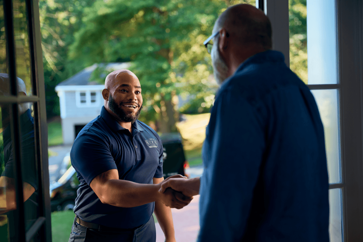 Technician shaking customers hand